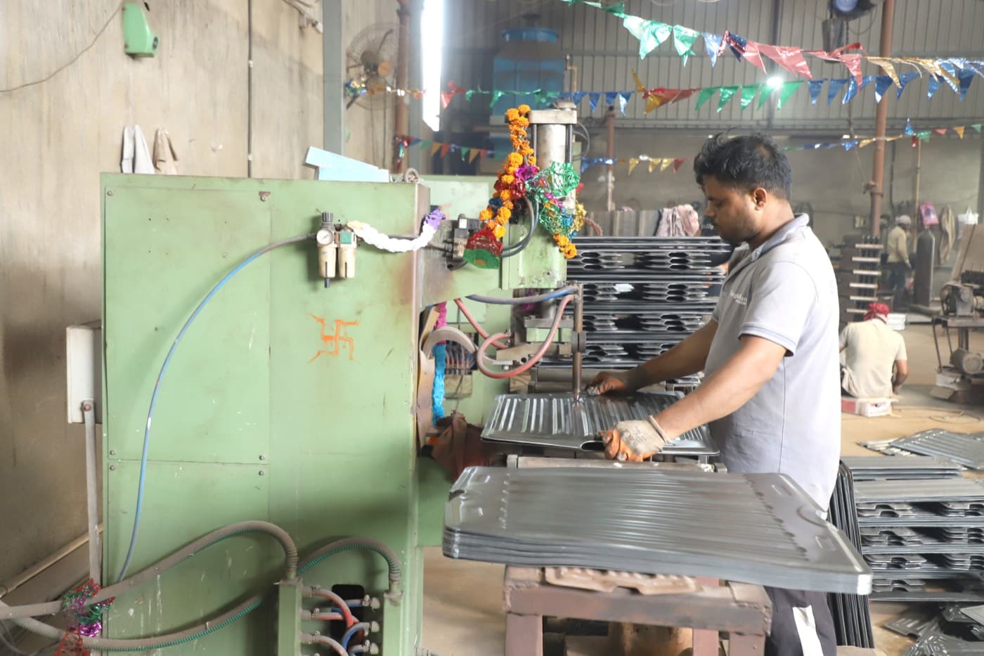 Spot-seam press forming a radiator panel
