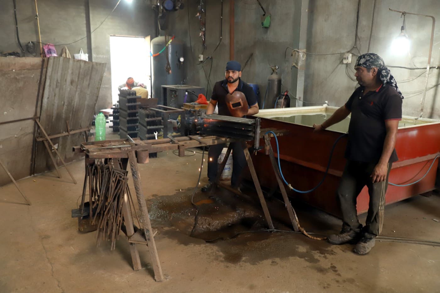 Final visual check of a finished, painted radiator